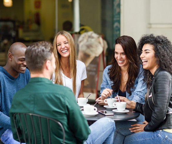 On of group of friends said a joke to his friends